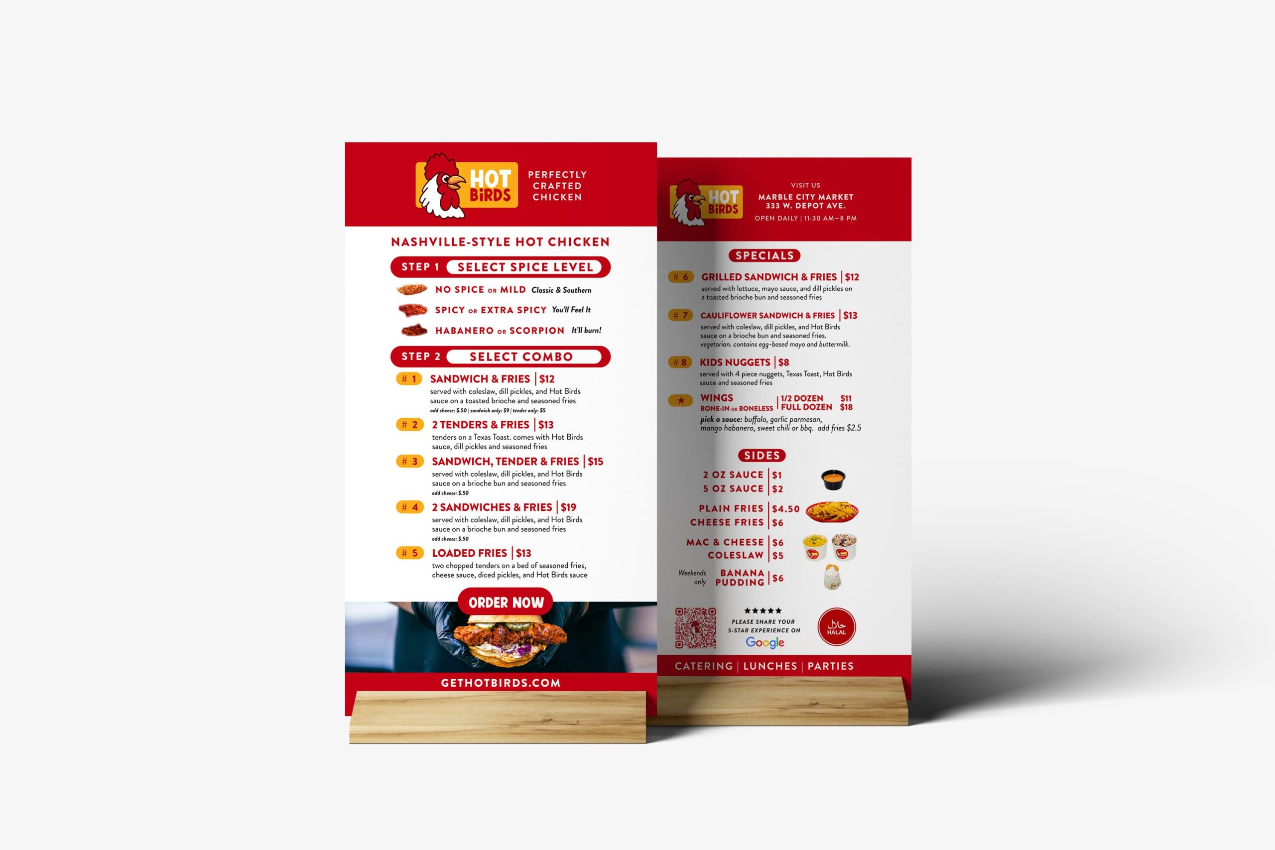 Two vertical printed menu cards in wooden stands detailing spice levels, combo choices, sides, halal certification badge, and a review QR code.