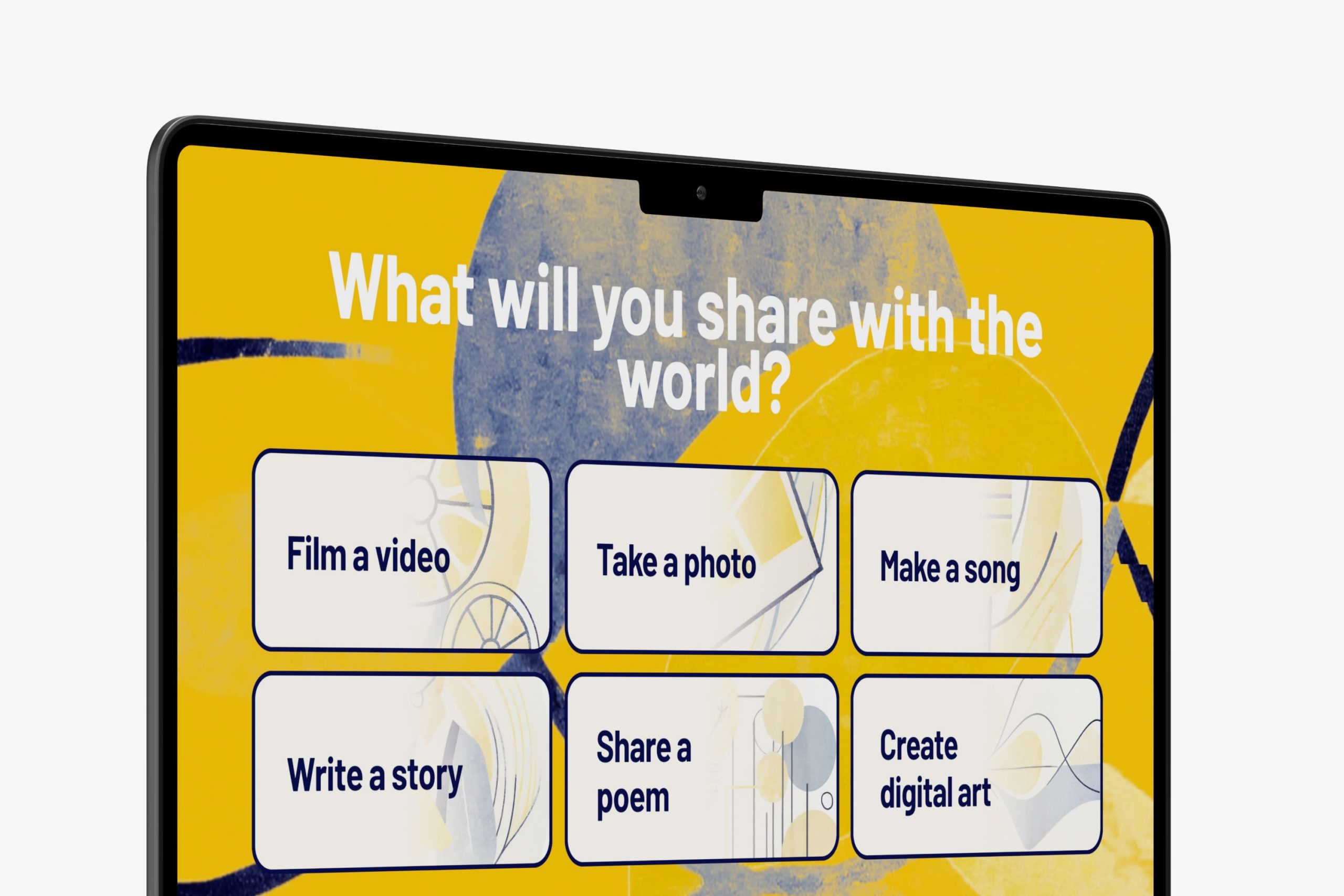 Angled close-up of a desktop screen showing the What will you share with the world? headline and creative medium selection cards.