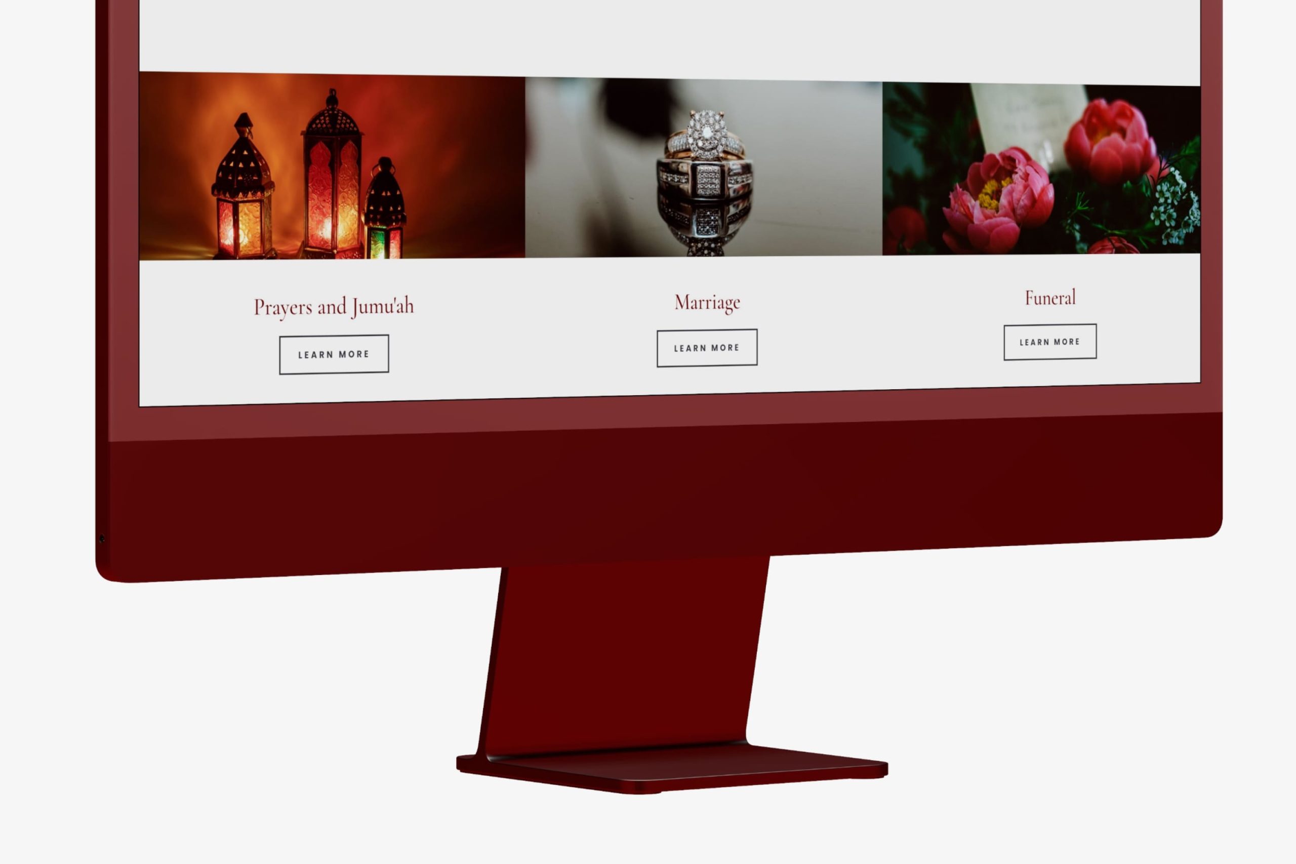 Angled close-up view of a desktop monitor displaying the Ramadan Better Together seasonal hub page with schedule cards and volunteer blocks.