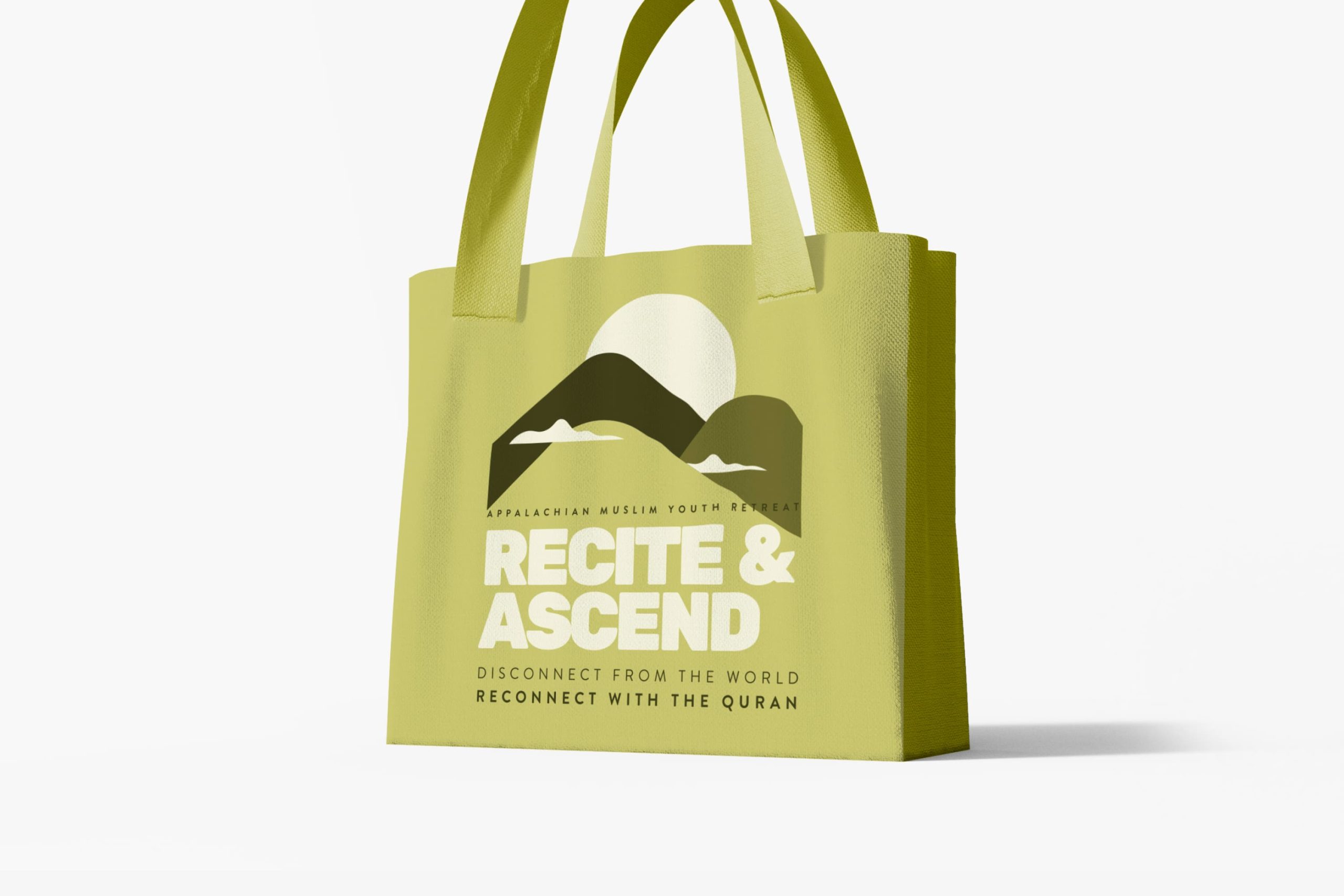 Light green canvas tote bag printed in dark green with the Appalachian Muslim Youth Retreat mountain graphic and tagline.