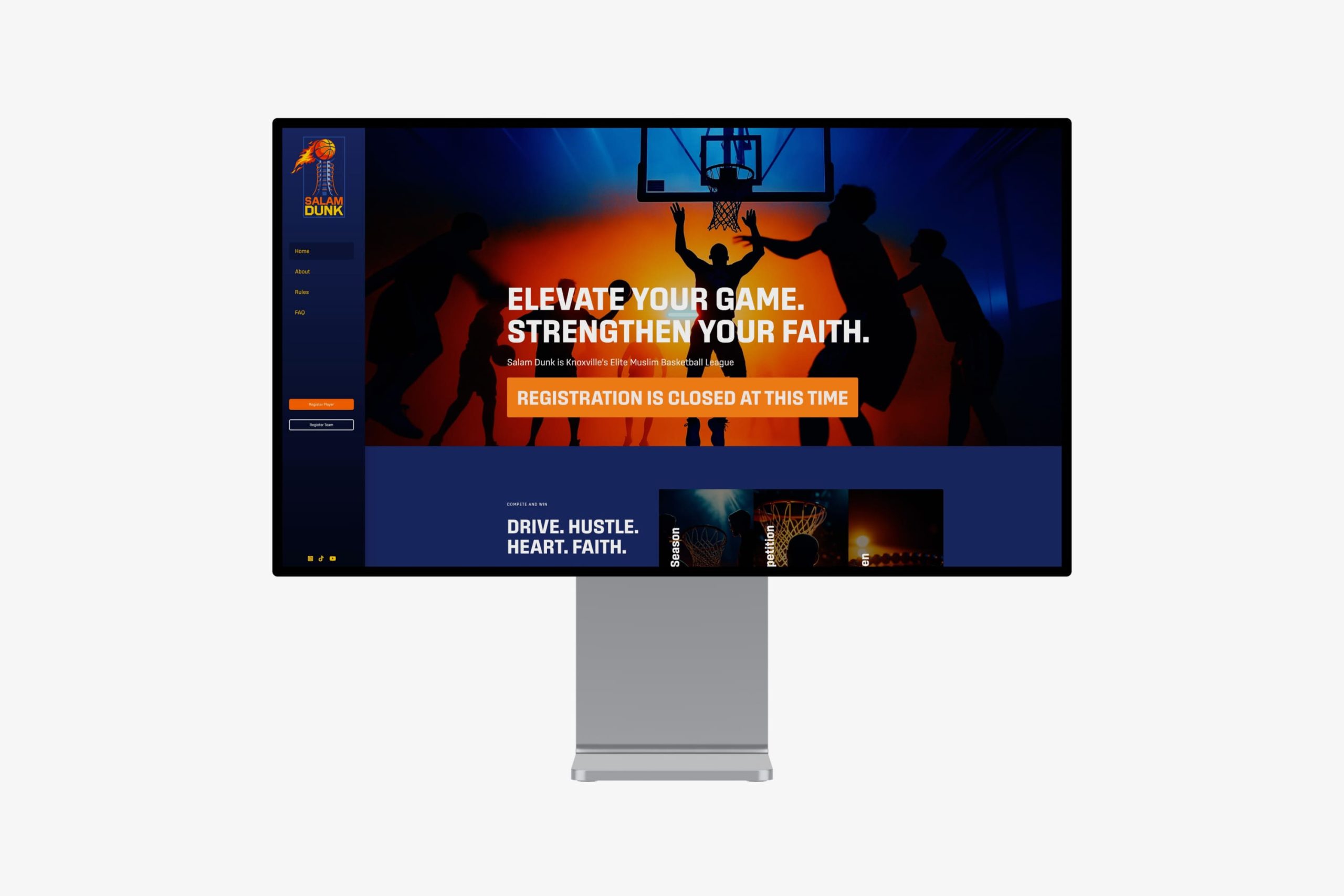 Angled close-up of a desktop monitor displaying the website hero with the headline Elevate Your Game. Strengthen Your Faith. and a registration status banner.