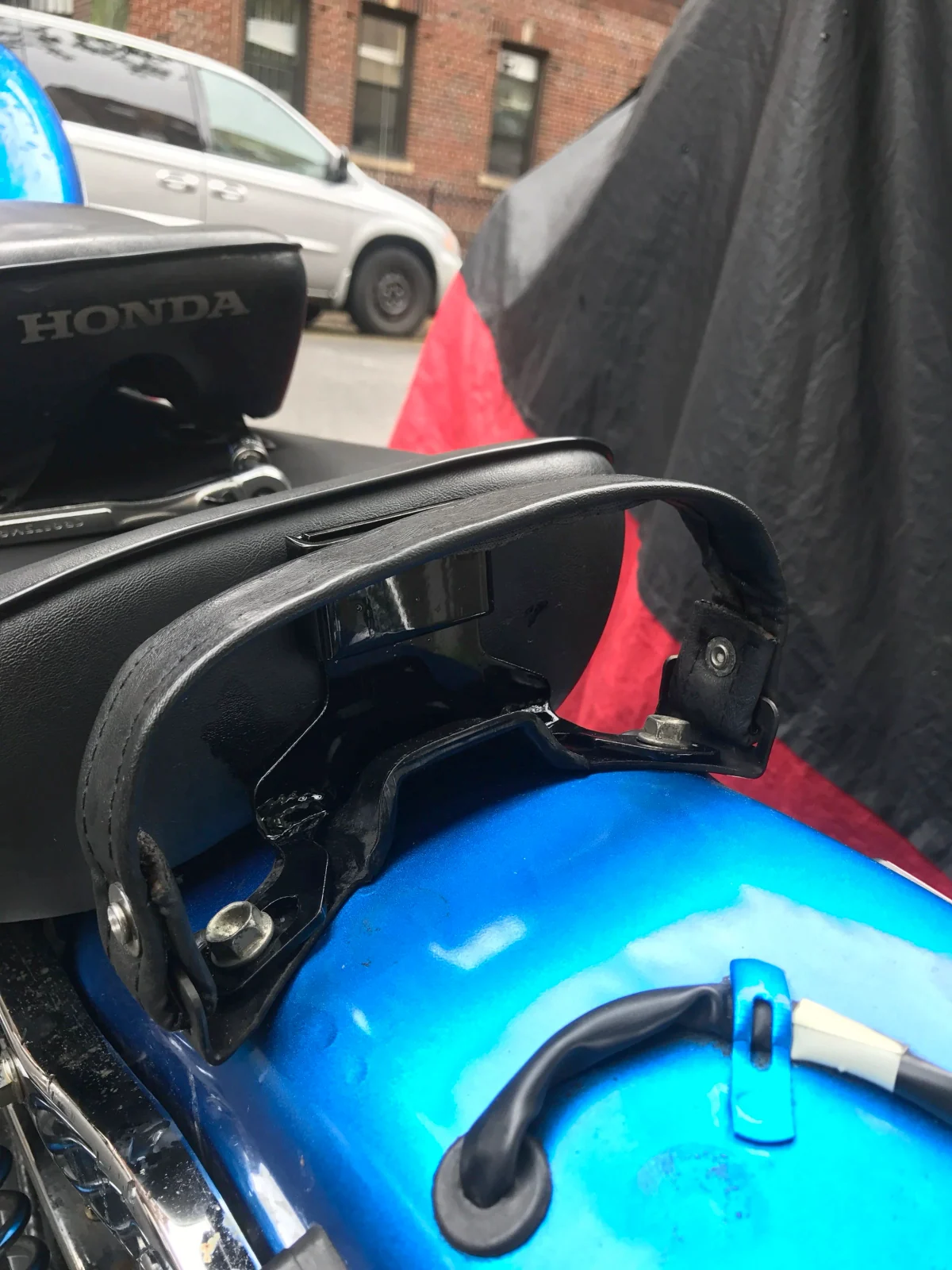 Installing an aftermarket driver back rest on a Honda Rebel 250