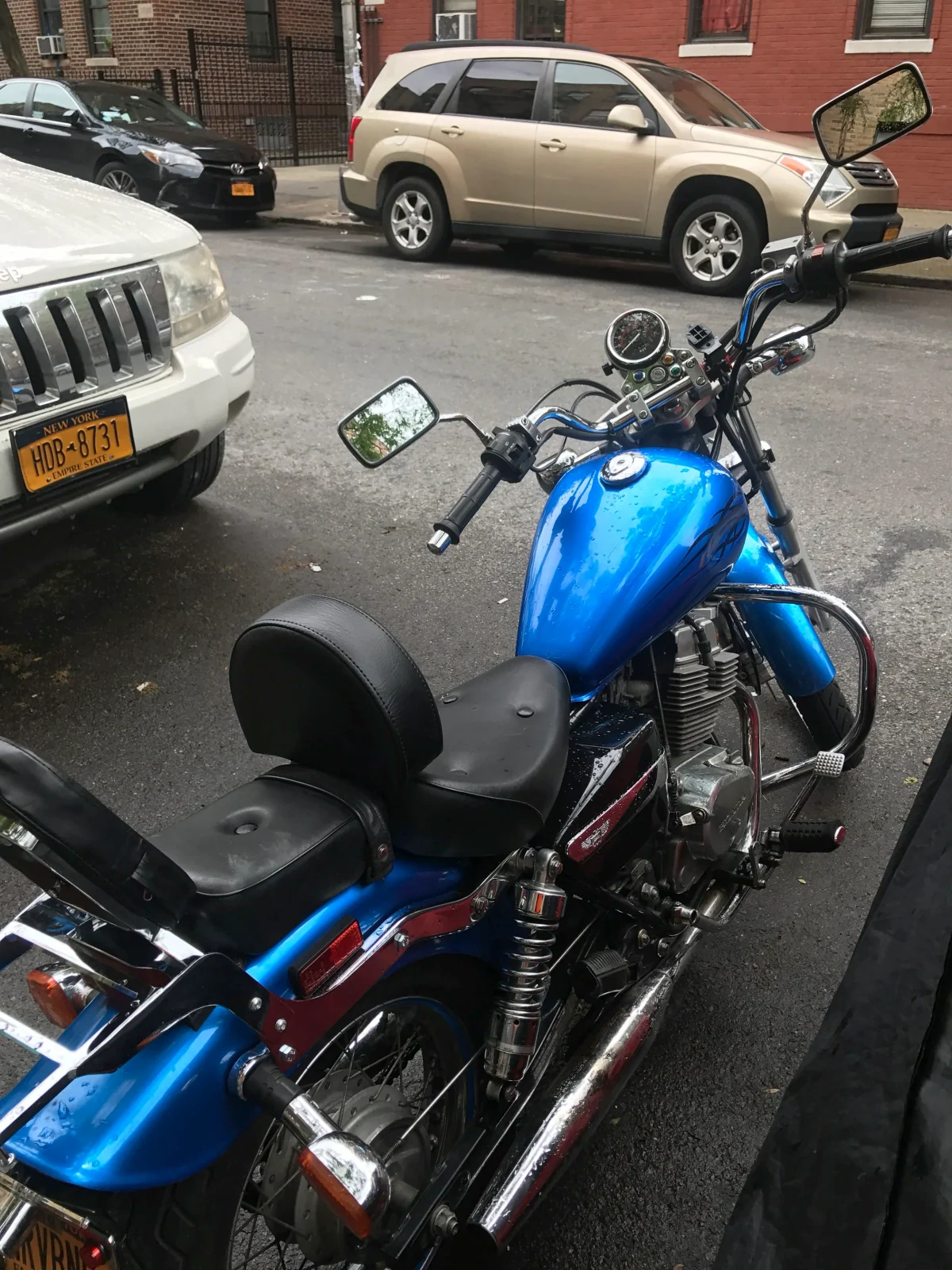 Installing an aftermarket driver back rest on a Honda Rebel 250