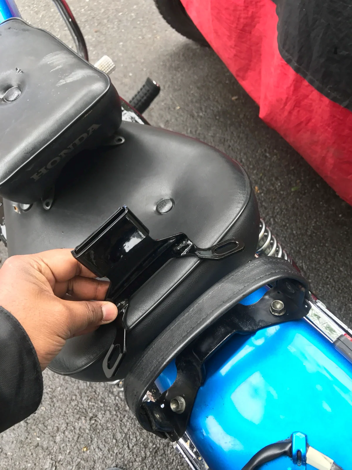Installing an aftermarket driver back rest on a Honda Rebel 250
